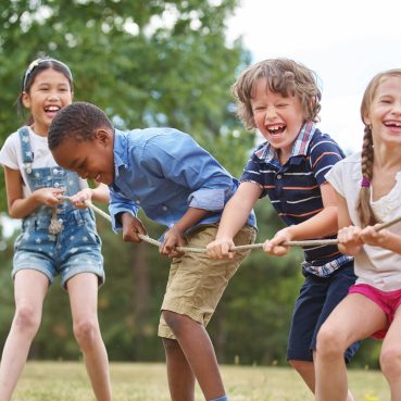 Children,Playing,Tug,Of,War,At,The,Park Children,Playing,Tug,Of,War,At,The,Park